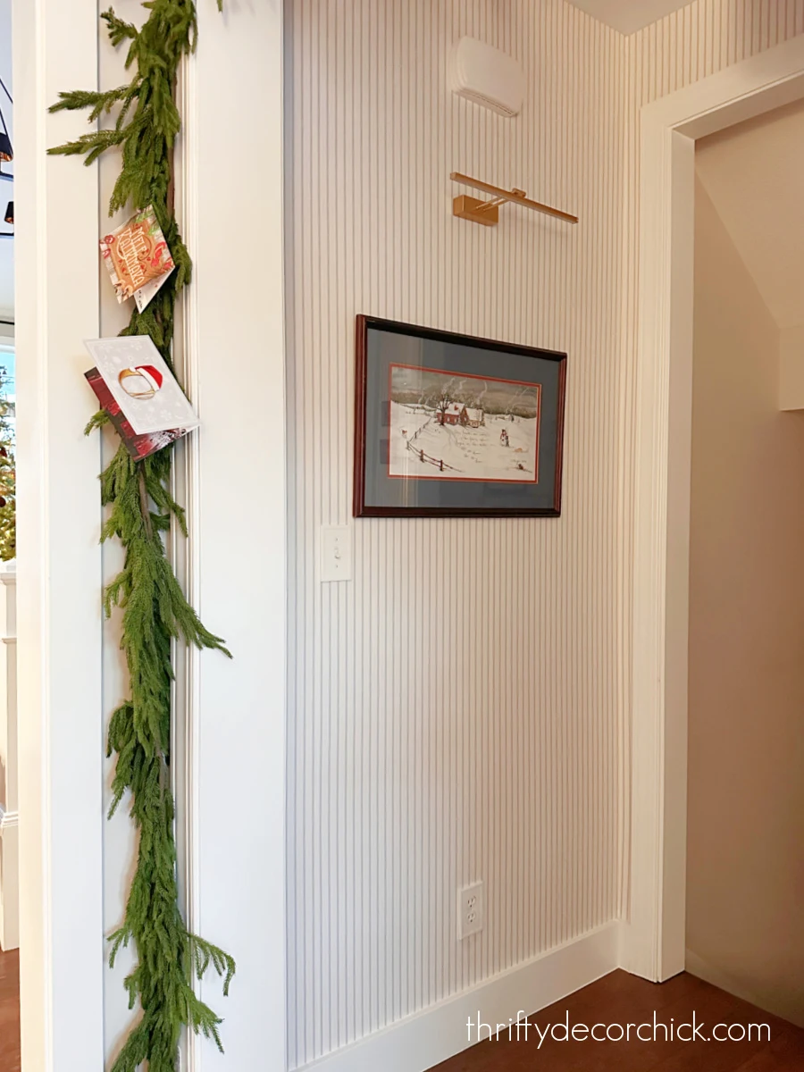 blue and white pinstripe wallpaper entryway